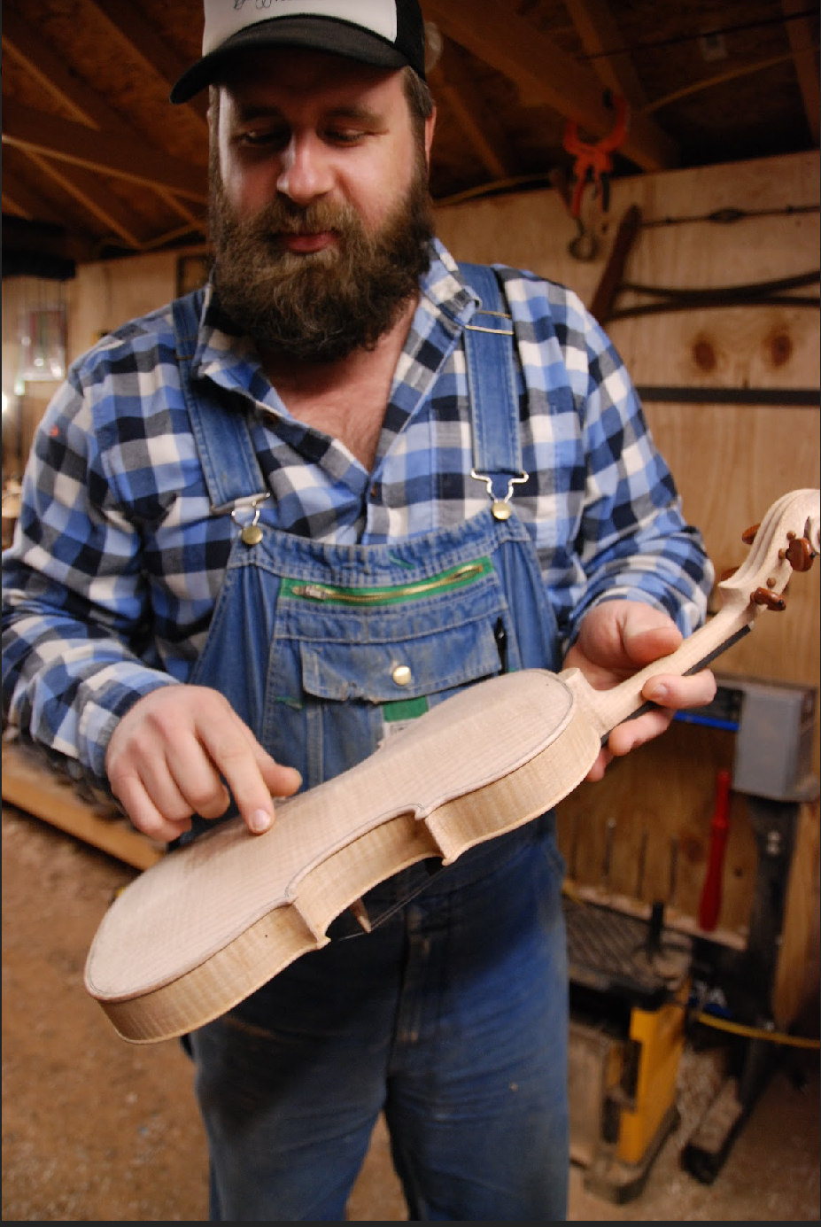 John Ryster teaching with one of his handmade violins for a fiddle making apprenticeship in eastern Kentucky.